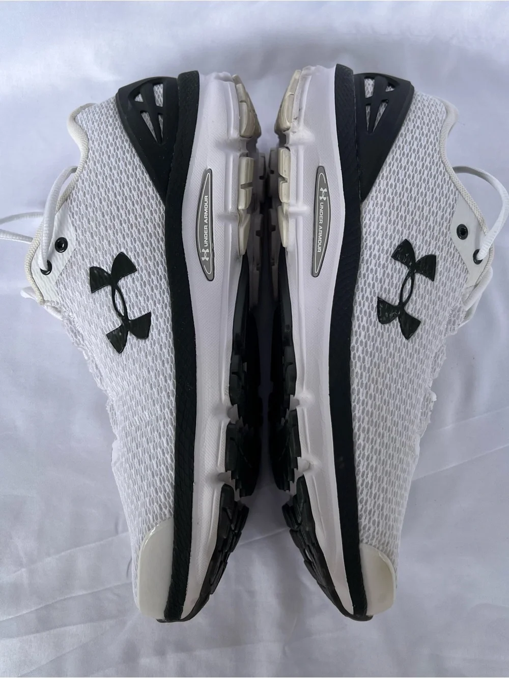 Under Armour (UA Charged Gemini) Mens White and Black Athletic Sneakers